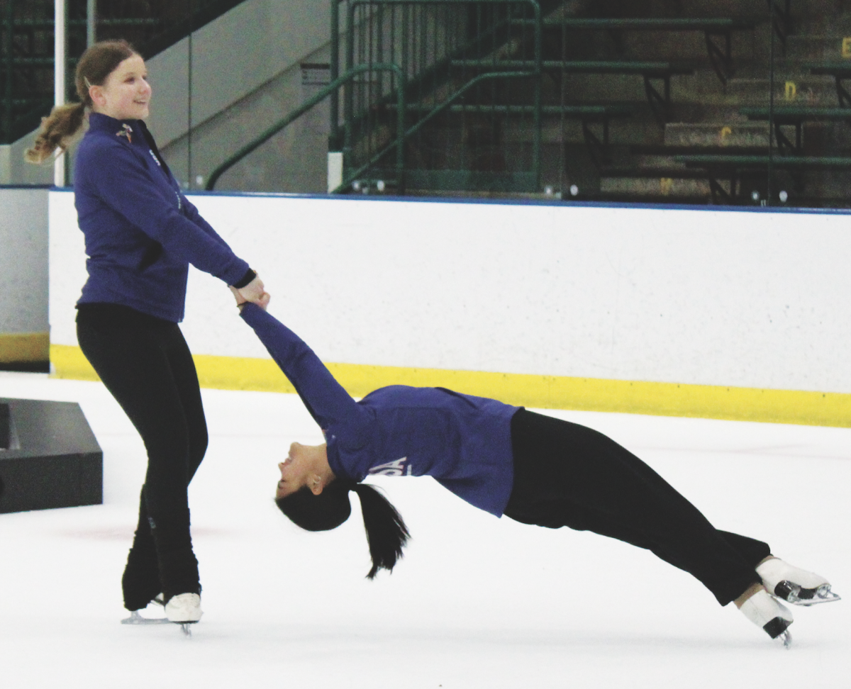 Seniors Emma Martinelli (left) and Hannah Yang perform a death spiral after practice on April 27. Martinelli and Yang competed on the United States Teams Elite Junior synchronized skating team, which was the first U.S. team to win an International Skating Union World Junior Synchronized Skating title. 
